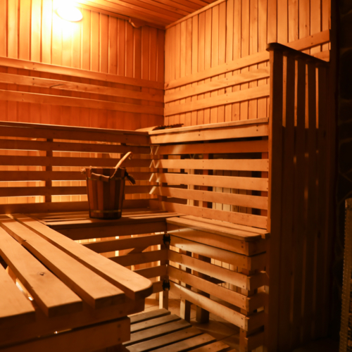 Interior of classic wooden sauna with bucket