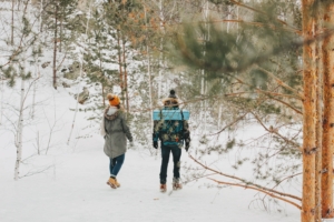 The happy couple in love of young man and woman at the forest nature park. Travel adventure love story